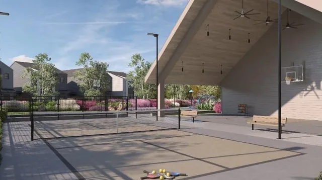 a building outdoor space with patio furniture and potted plants