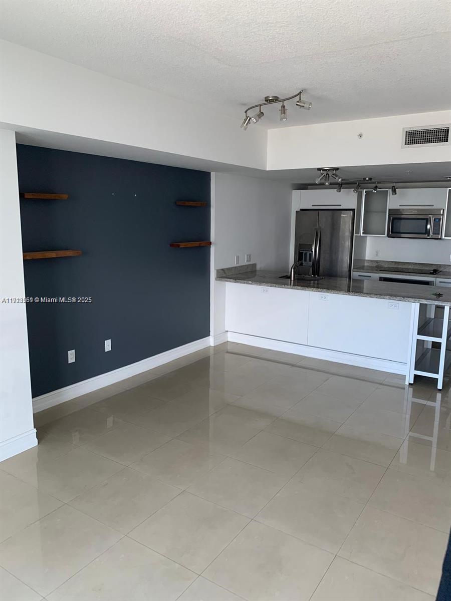 a bathroom with a bathtub and a sink