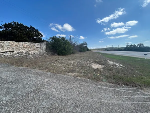 a view of a lake with sunset in background