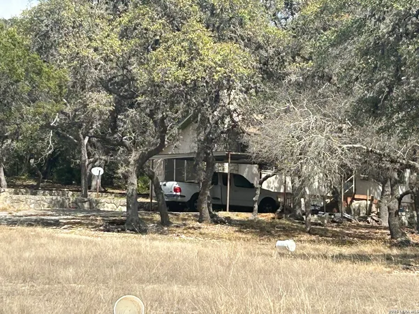 a view of a house with snow on the road