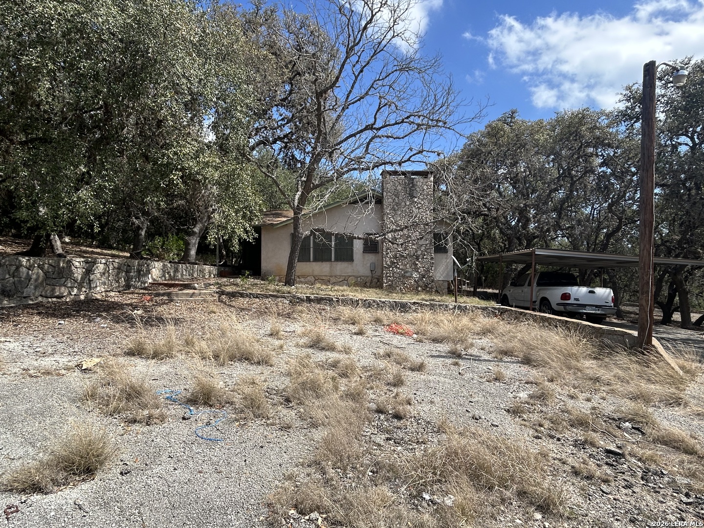 18810 Bandera Road Helotes, TX 78023 - Photo 9 of 29 a view of a backyard with large trees