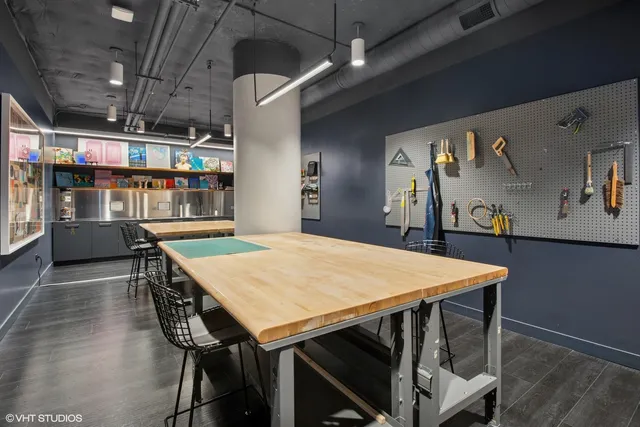 a dining room with a wooden table and chairs