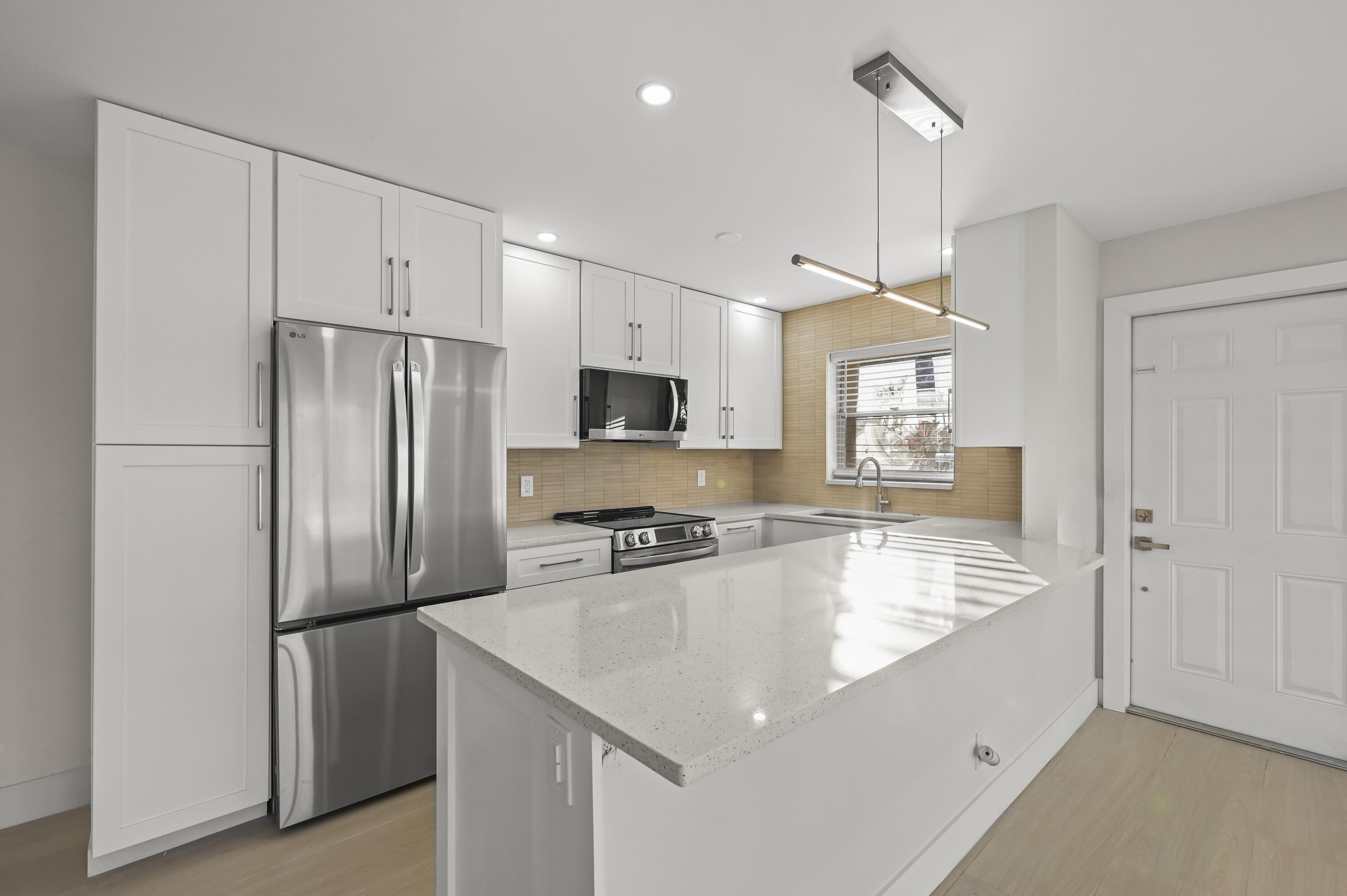 890 High Point Boulevard North, Unit A Delray Beach, FL 33445 - Photo 1 of 40 Kitchen