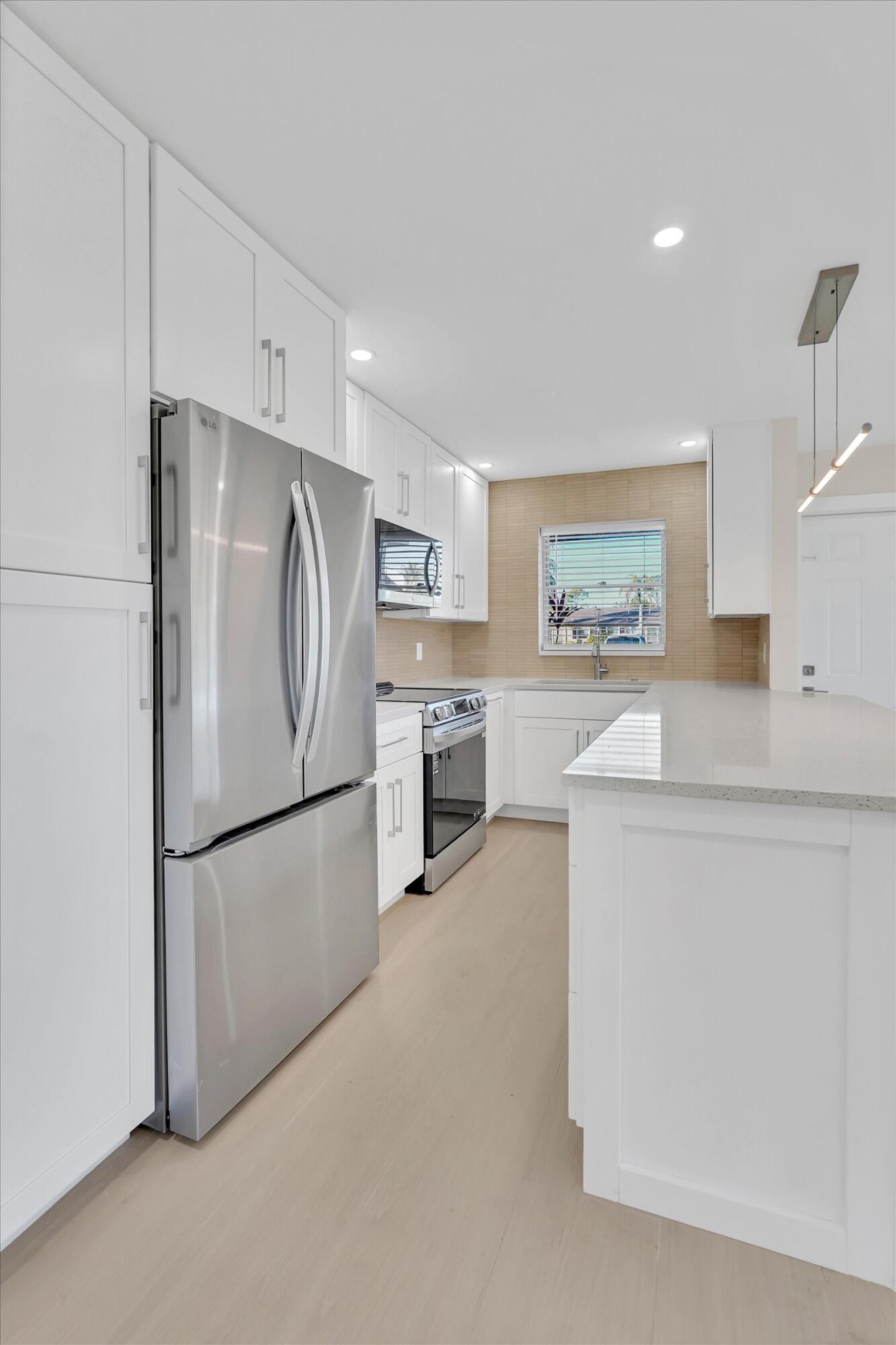 890 High Point Boulevard North, Unit A Delray Beach, FL 33445 - Photo 3 of 40 21-890 High Point Blvd N-21