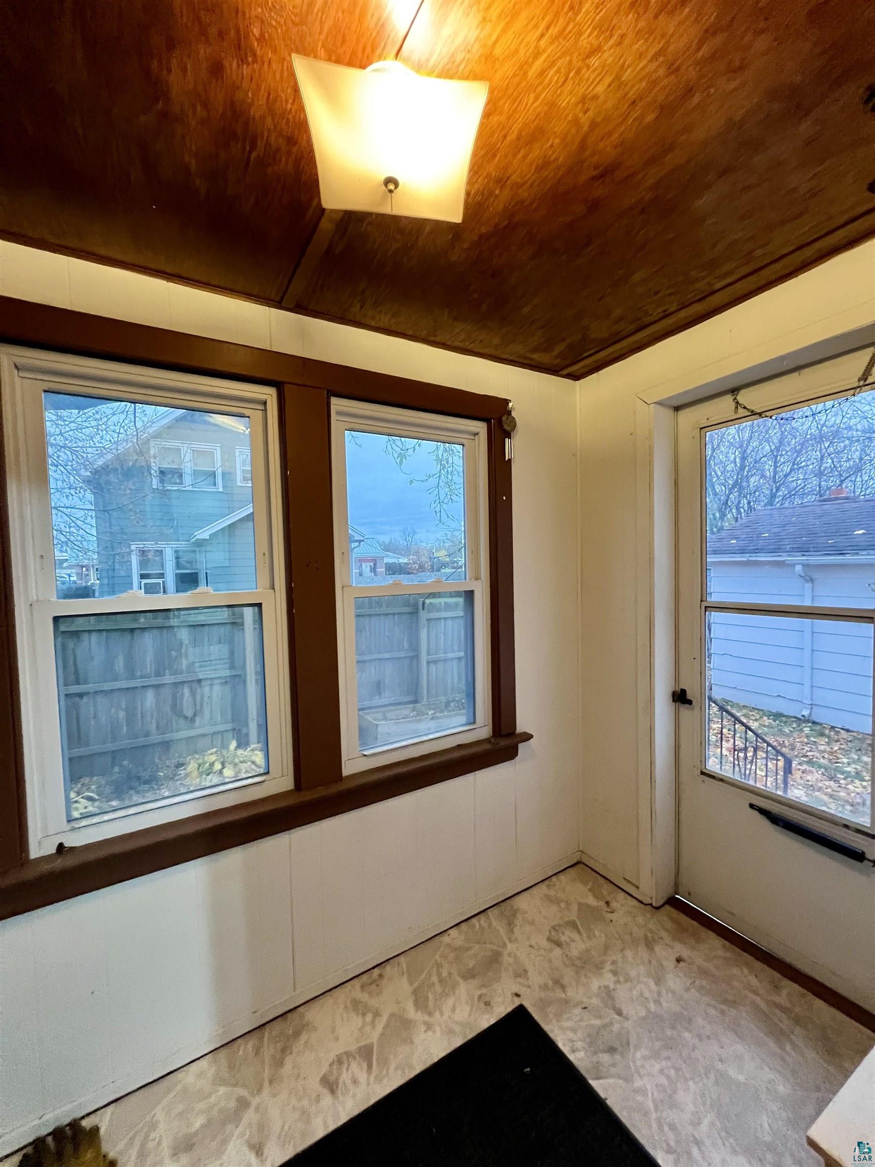 6512 Raleigh Street Duluth, MN 55807 - Photo 11 of 14 Spare room featuring wood ceiling