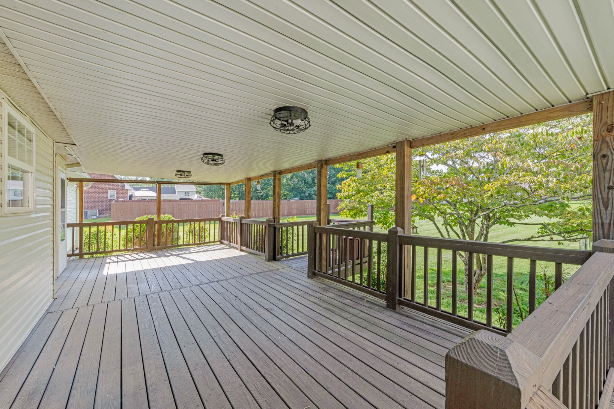 212 Independence Street Springfield, TN 37172 - Photo 22 of 26 a view of a porch with wooden floor
