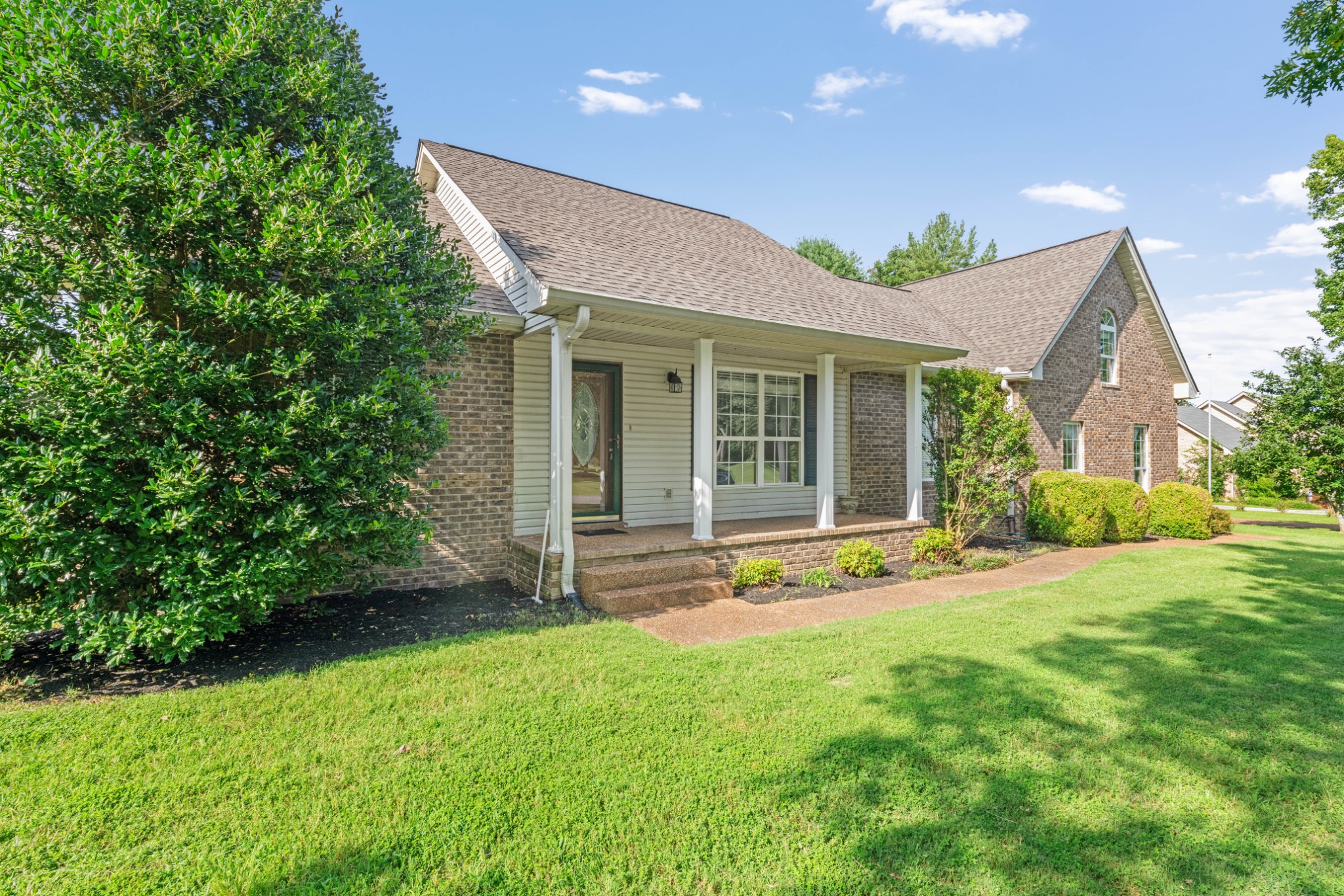 212 Independence Street Springfield, TN 37172 - Photo 3 of 26 a view of a house with a yard and sitting area