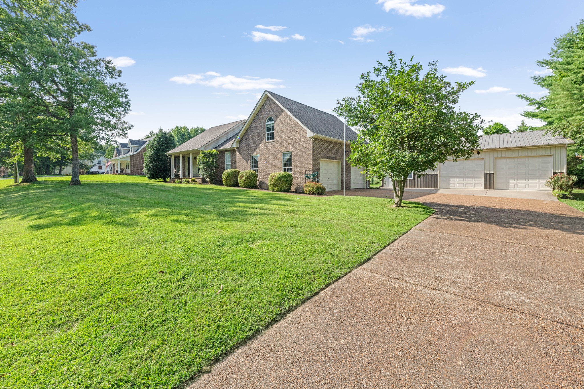 212 Independence Street Springfield, TN 37172 - Photo 4 of 26 a front view of a house with a yard and trees
