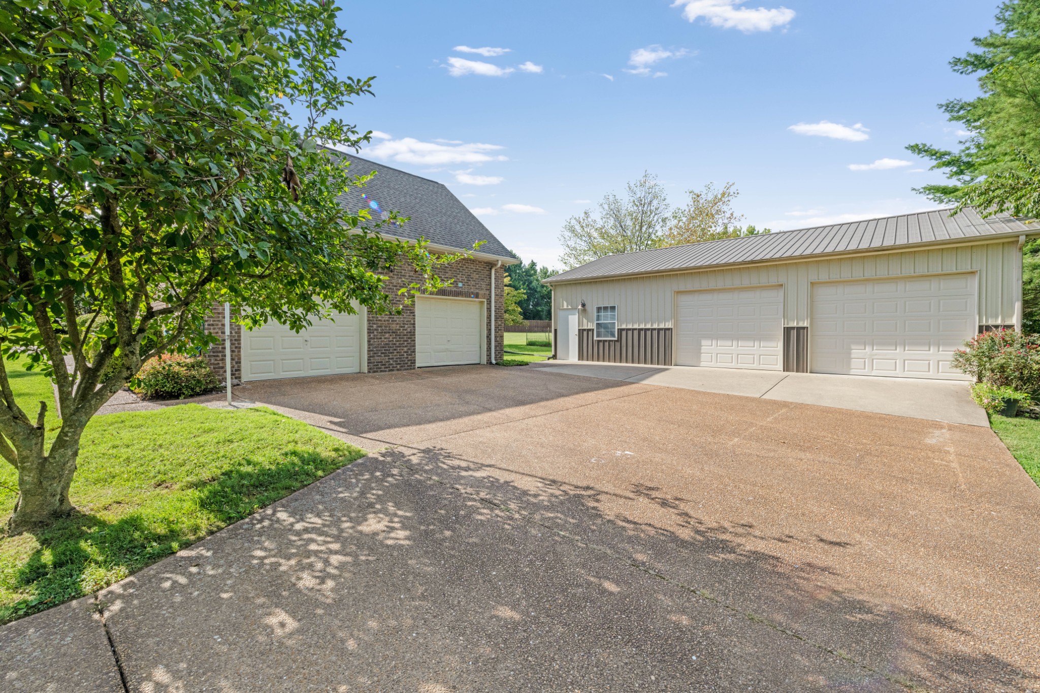 212 Independence Street Springfield, TN 37172 - Photo 5 of 26 a front view of a house with a yard and a garage