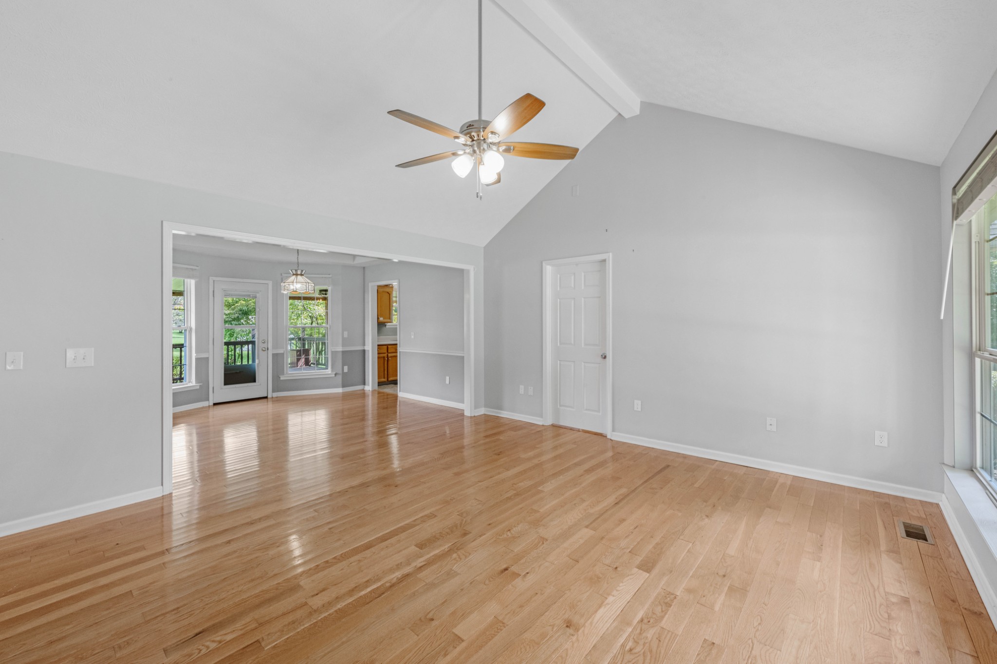 212 Independence Street Springfield, TN 37172 - Photo 6 of 26 a view of empty room with wooden floor and fan