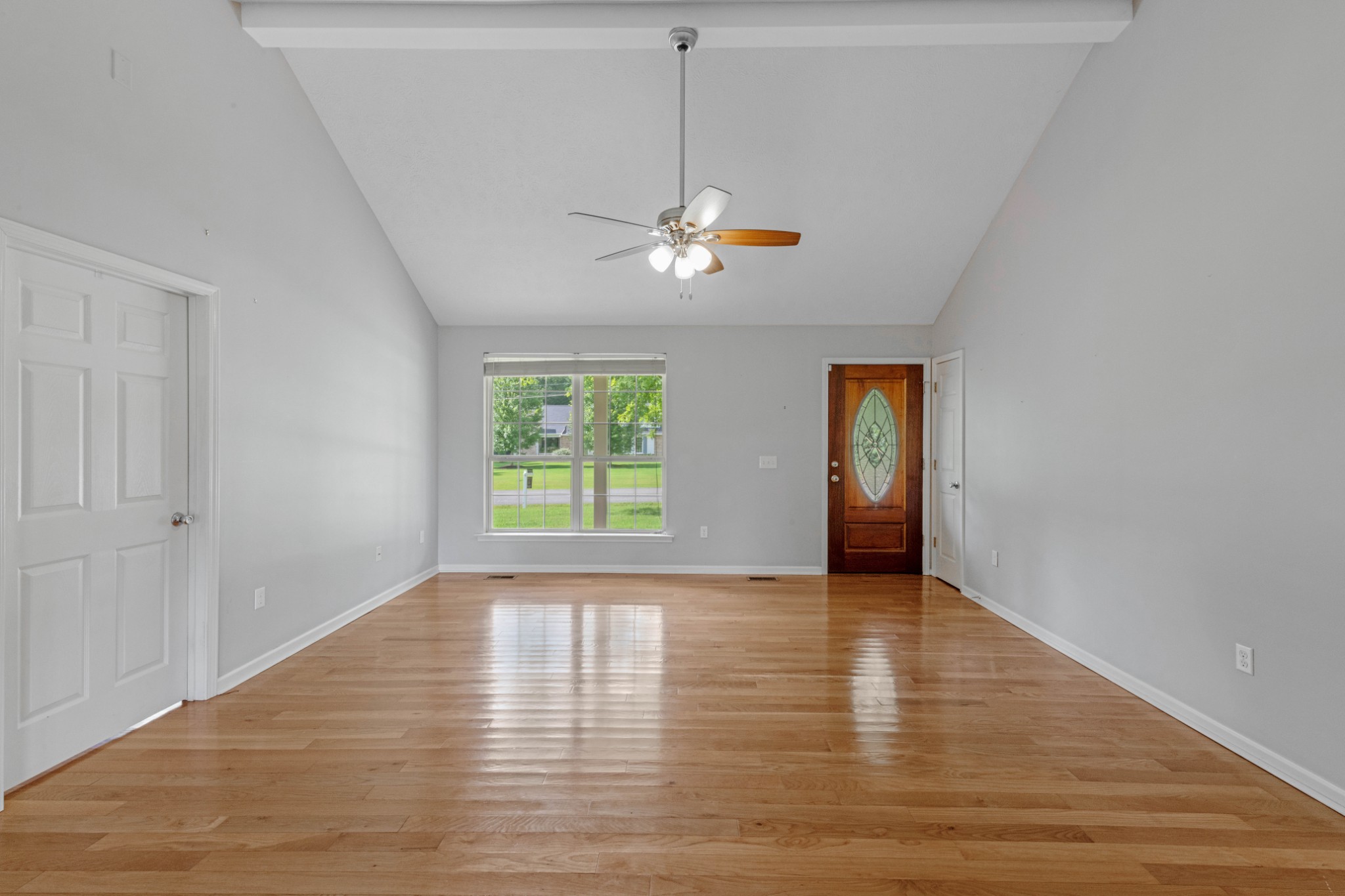 212 Independence Street Springfield, TN 37172 - Photo 7 of 26 a view of empty room with wooden floor and fan