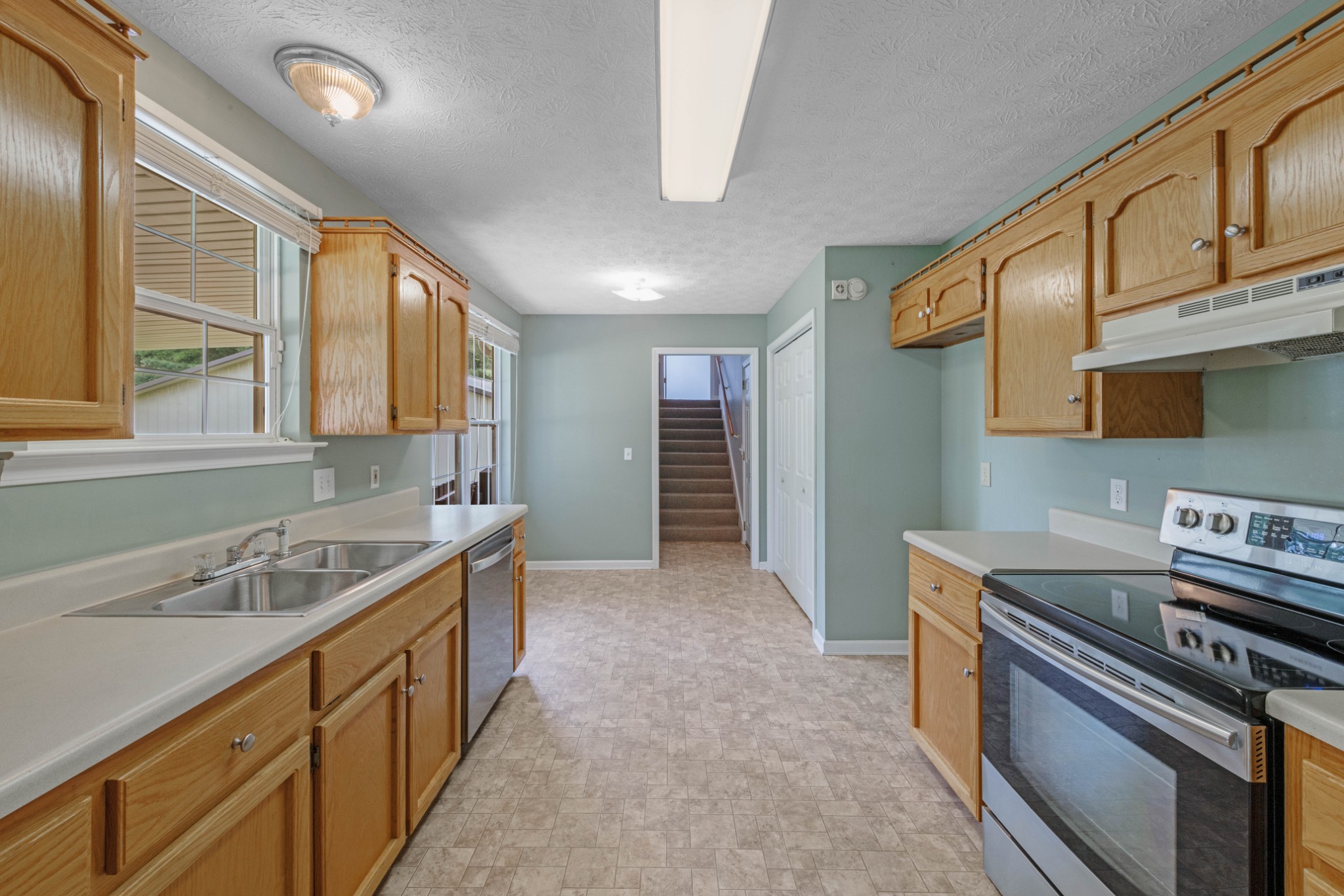 212 Independence Street Springfield, TN 37172 - Photo 9 of 26 a kitchen that has a sink and a stove