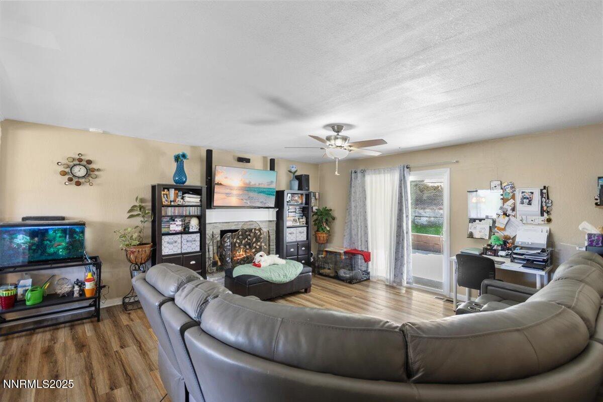 160 Cheyenne Drive Reno, NV 89521 - Photo 11 of 32 a living room with furniture and wooden floor