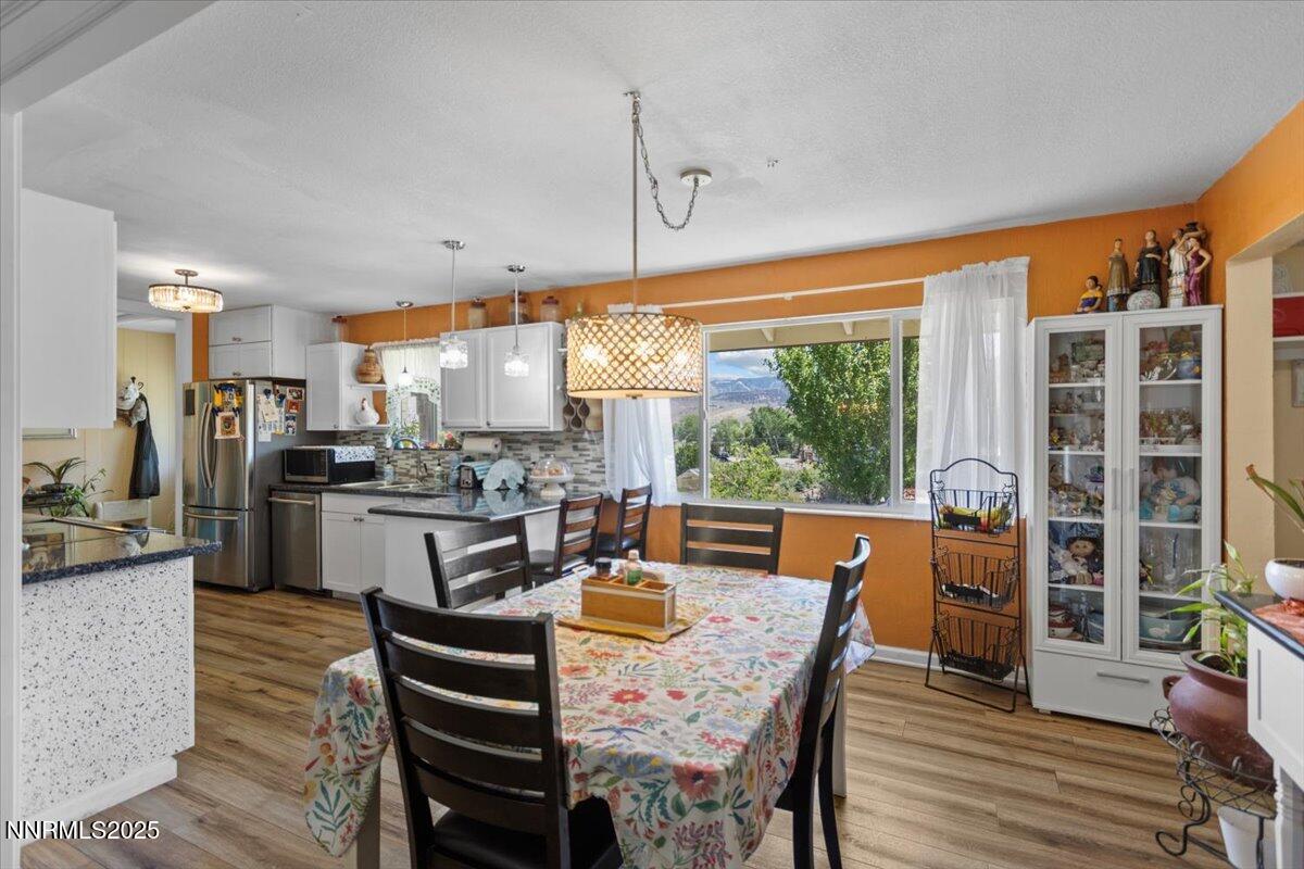 160 Cheyenne Drive Reno, NV 89521 - Photo 12 of 32 a view of a dining room with furniture window and wooden floor