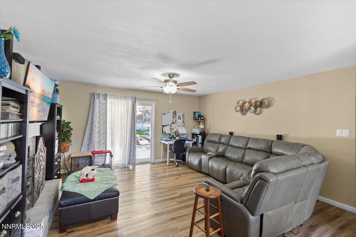 160 Cheyenne Drive Reno, NV 89521 - Photo 15 of 32 a living room with furniture fireplace and a flat screen tv