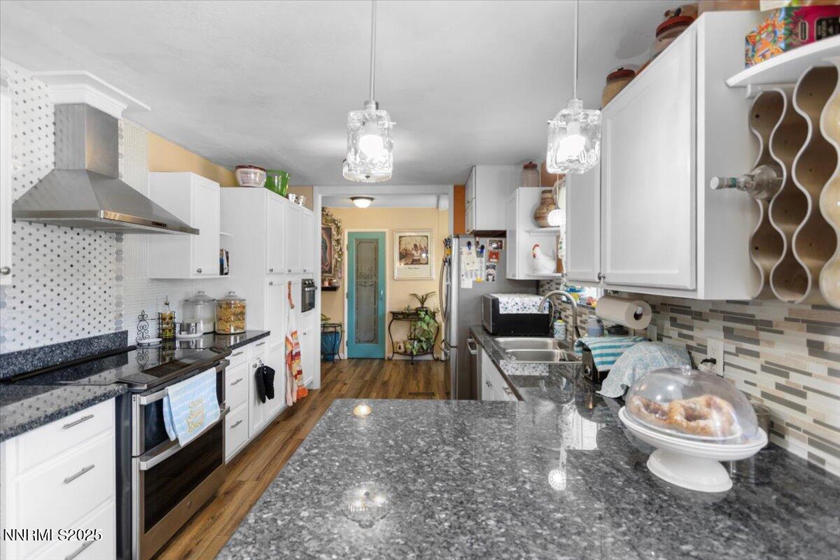 160 Cheyenne Drive Reno, NV 89521 - Photo 6 of 32 a large white kitchen with a lot of white cabinets