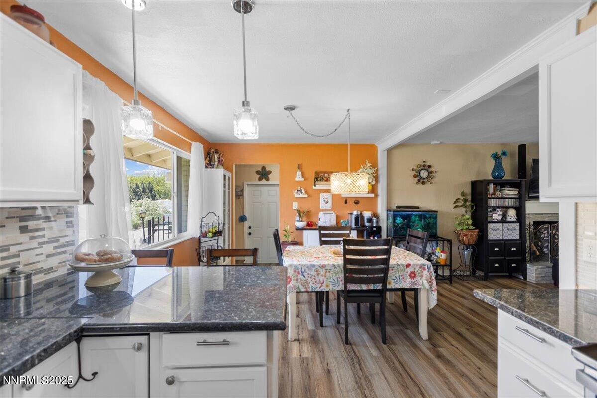 160 Cheyenne Drive Reno, NV 89521 - Photo 8 of 32 a view of a kitchen with kitchen island granite countertop a large window cabinets a sink and stainless steel appliances
