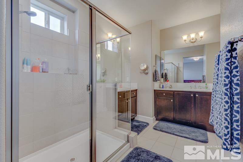 2024 Wind Ranch Road, Unit B Reno, NV 89521 - Photo 13 of 18 a bathroom with a sink and a mirror