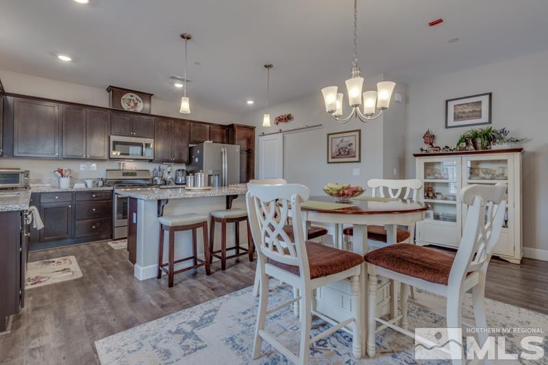 2024 Wind Ranch Road, Unit B Reno, NV 89521 - Photo 6 of 18 a view of a dining room with furniture