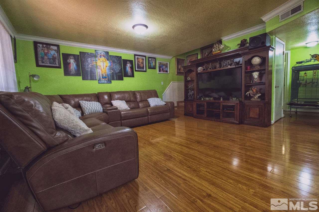 2375 Trident Way Reno, NV 89512 - Photo 3 of 25 a living room with furniture and a fireplace