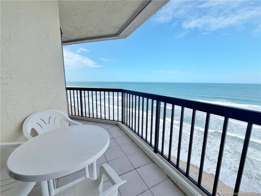 9500 South Ocean Drive, Unit HIGHER Jensen Beach, FL 34957 - Photo 13 of 53 a view of a balcony wooden floor