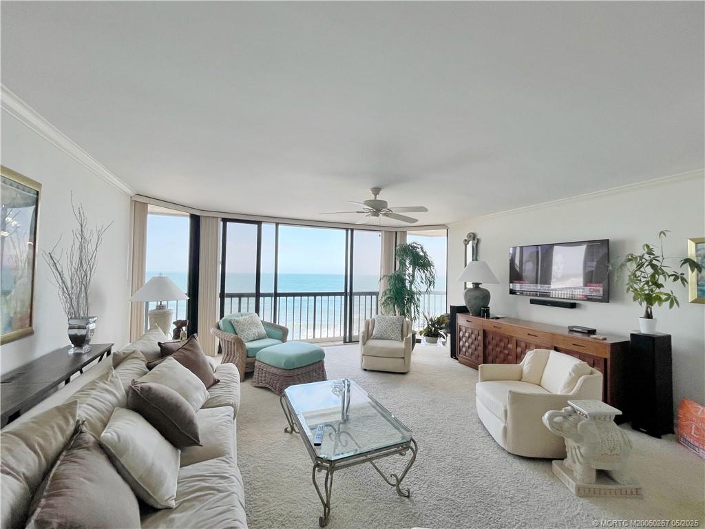 9500 South Ocean Drive, Unit HIGHER Jensen Beach, FL 34957 - Photo 22 of 53 a living room with furniture and a flat screen tv