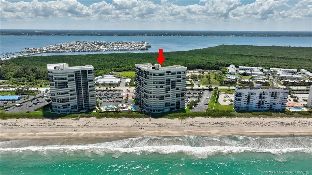 9500 South Ocean Drive, Unit HIGHER Jensen Beach, FL 34957 - Photo 33 of 53 a view of swimming pool from a yard