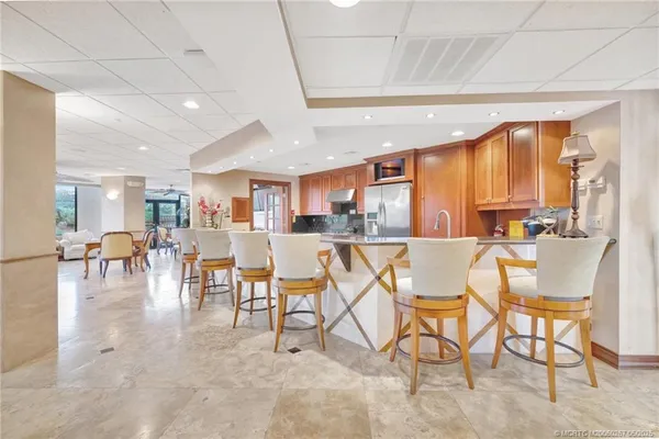 a living room with lots of furniture and a chandelier