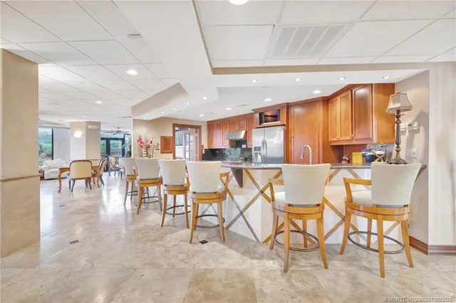 a living room with lots of furniture and a chandelier