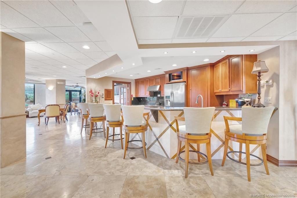 9500 South Ocean Drive, Unit HIGHER Jensen Beach, FL 34957 - Photo 49 of 53 a view of a dining room with furniture