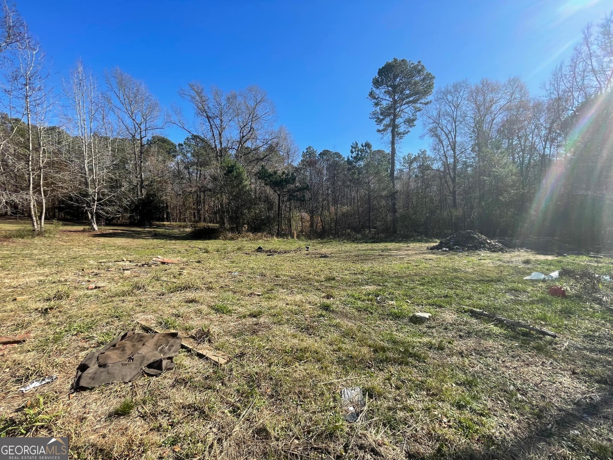 998 Campbell Road Meansville, GA 30256 - Photo 2 of 30 a view of outdoor space with deck and tree