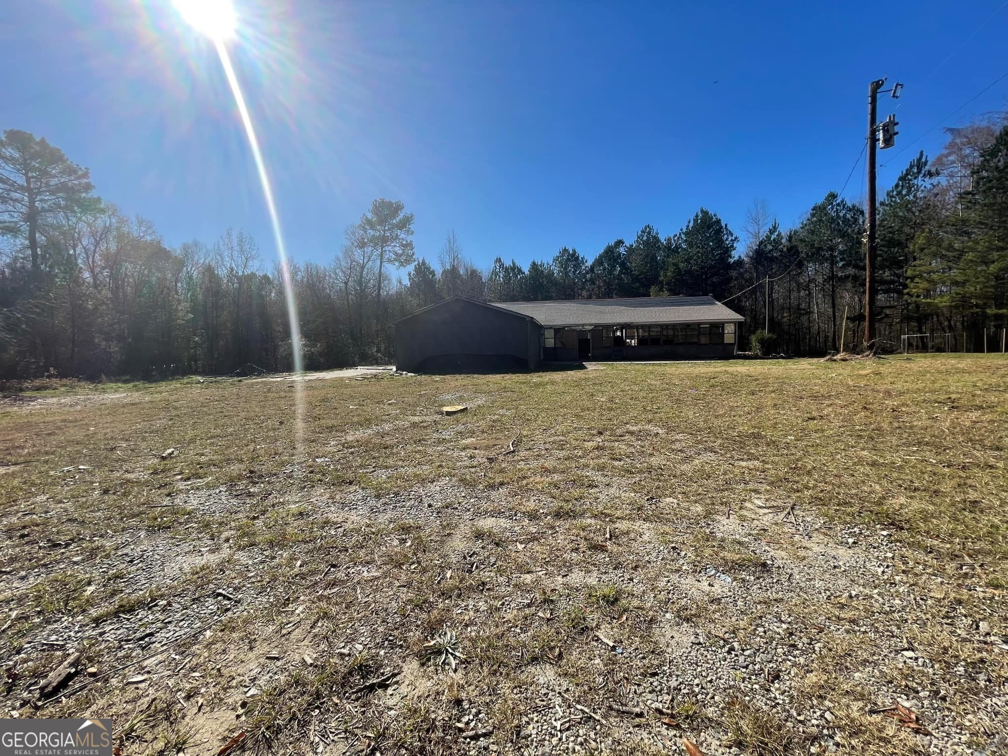 998 Campbell Road Meansville, GA 30256 - Photo 21 of 30 a street view with large trees