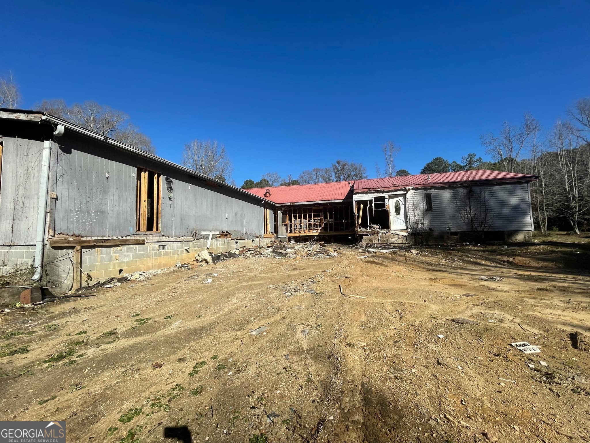 998 Campbell Road Meansville, GA 30256 - Photo 24 of 30 a view of a house with a backyard