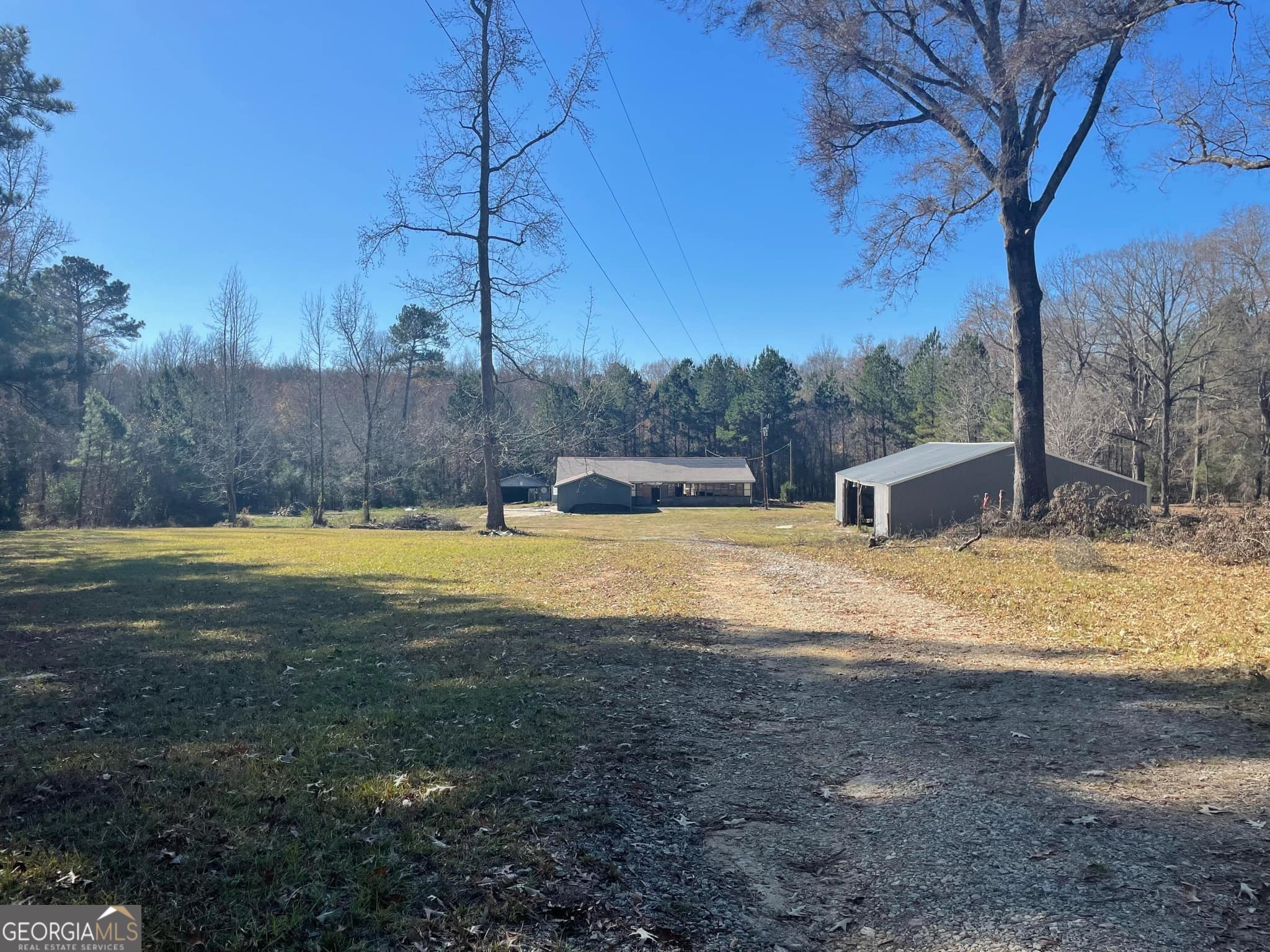 998 Campbell Road Meansville, GA 30256 - Photo 3 of 30 a view of a house with a yard