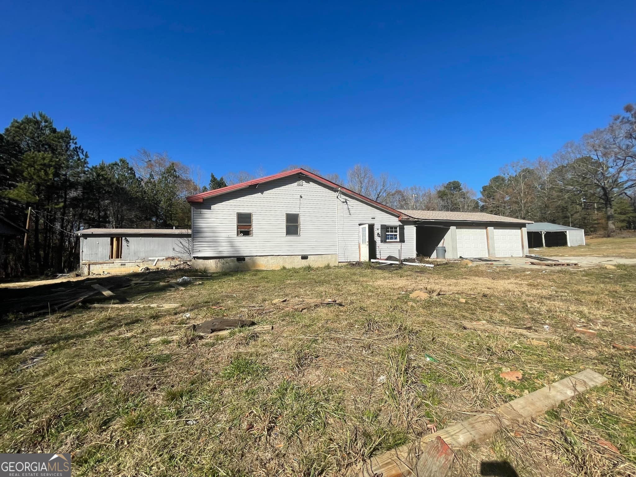 998 Campbell Road Meansville, GA 30256 - Photo 6 of 30 a house view with a outdoor space