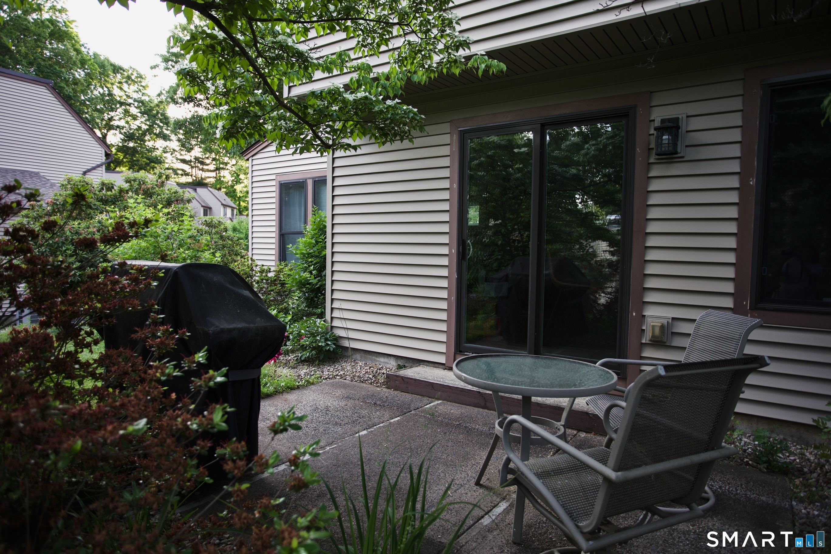3 Walnut Lane, Unit 3 Avon, CT 06001 - Photo 22 of 22 a view of a backyard with sitting area and garden