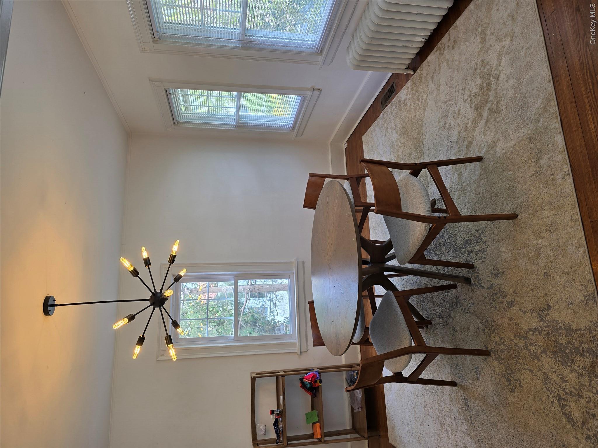 15 Roosevelt Avenue Rye, NY 10580 - Photo 5 of 13 a dining room with furniture and window