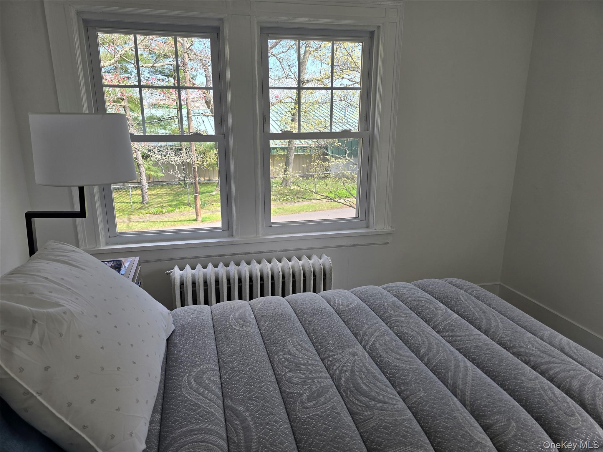 15 Roosevelt Avenue Rye, NY 10580 - Photo 7 of 13 a bedroom with a bed and window