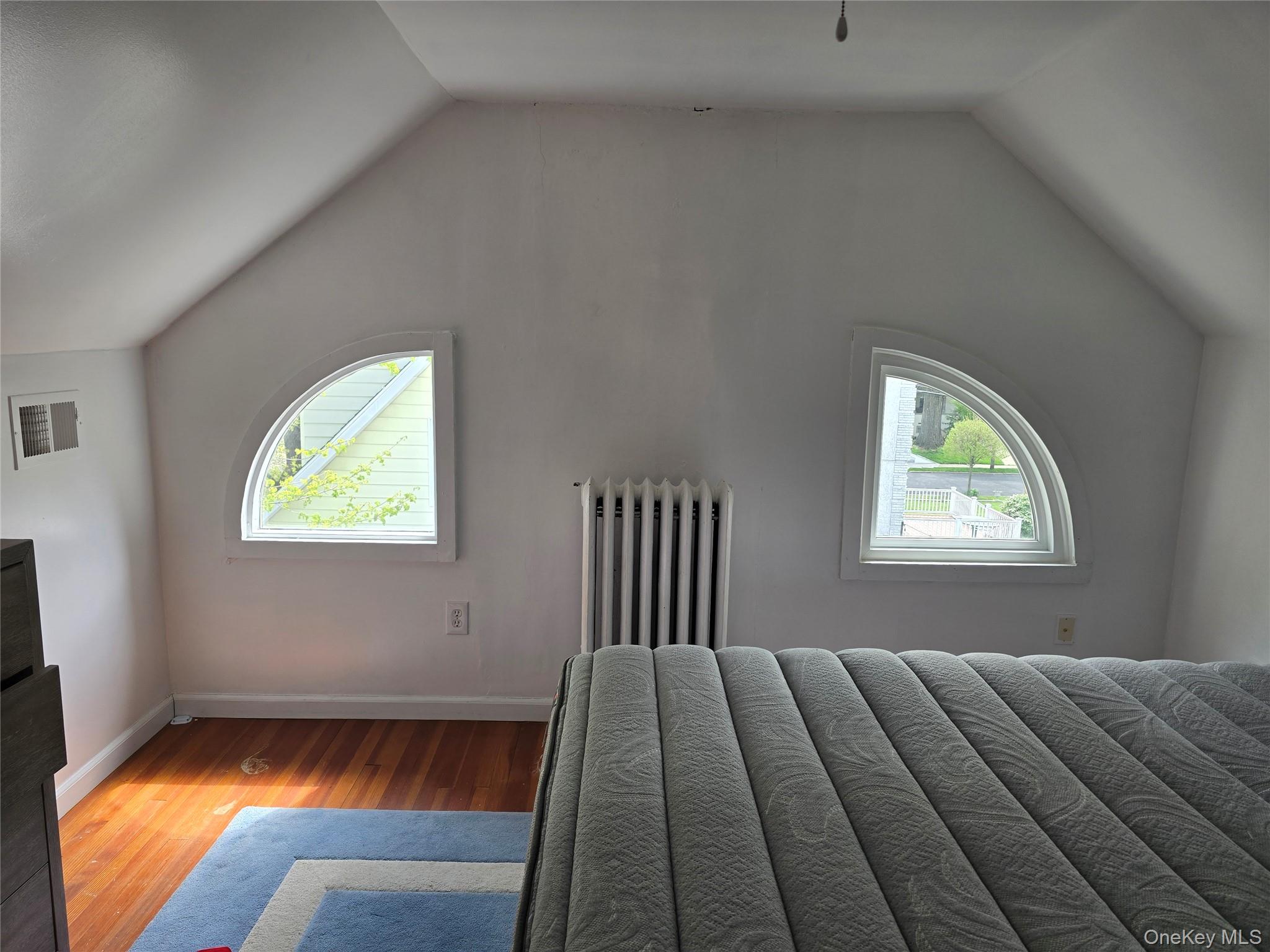 15 Roosevelt Avenue Rye, NY 10580 - Photo 8 of 13 a bed sitting in a bedroom next to a window