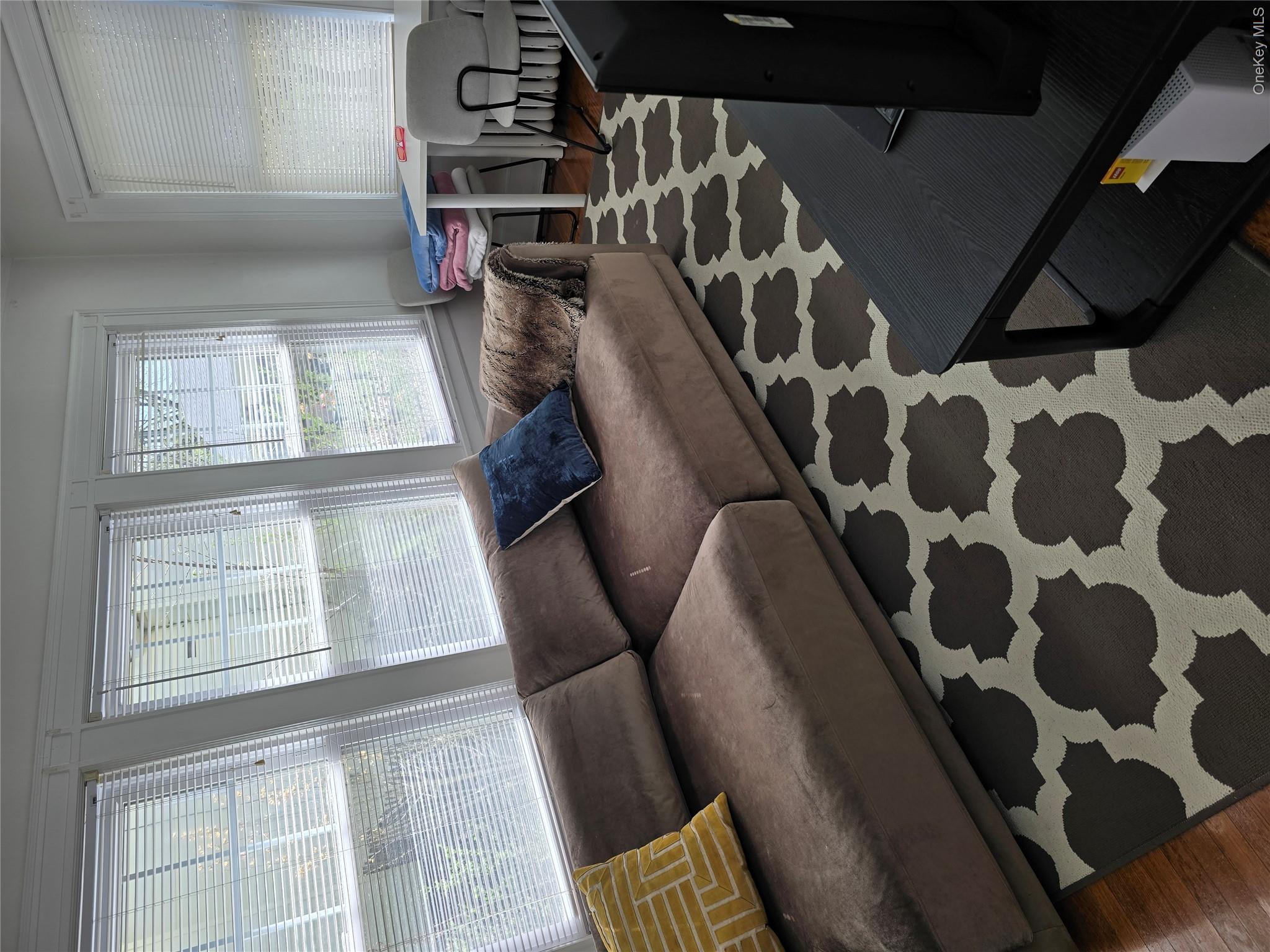 15 Roosevelt Avenue Rye, NY 10580 - Photo 9 of 13 a living room with furniture and a window