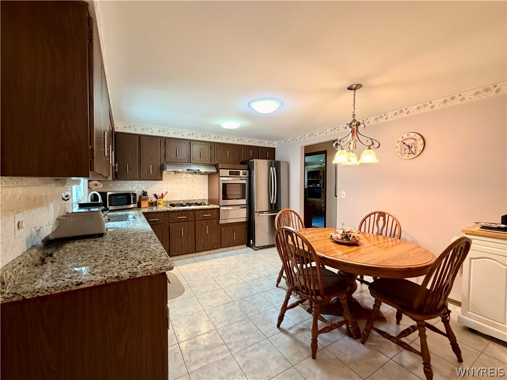 229 Wind Mill Road West Seneca, NY 14224 - Photo 16 of 49 kitchen offers ceramic floors & granite counters