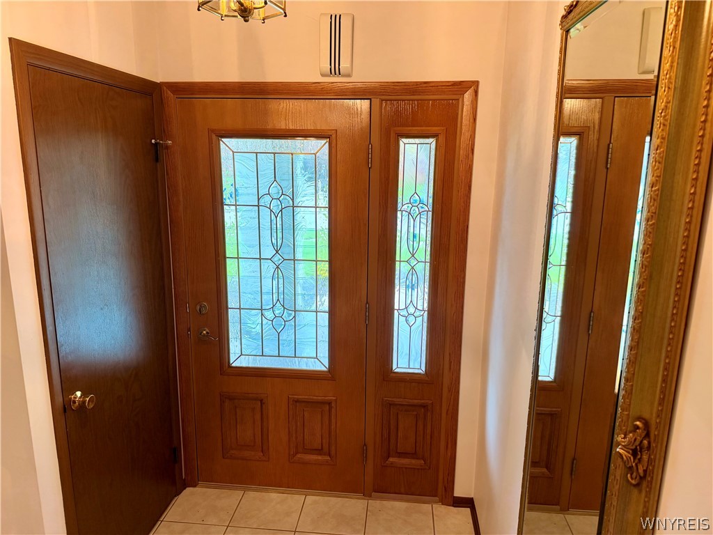 229 Wind Mill Road West Seneca, NY 14224 - Photo 3 of 49 Leaded windows sparkle in the entry