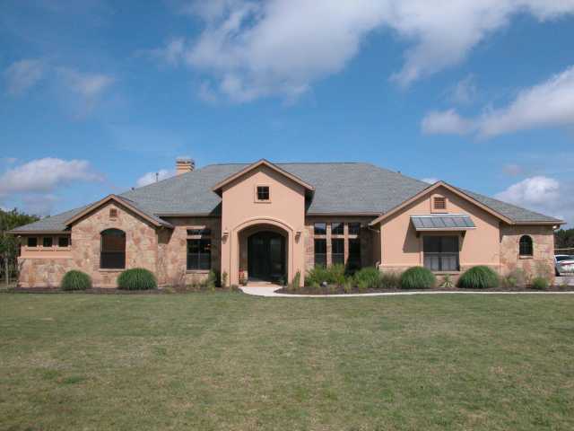 9404 San Lucas Road Austin, TX 78737 - Photo 1 of 1 a view of a house with a yard