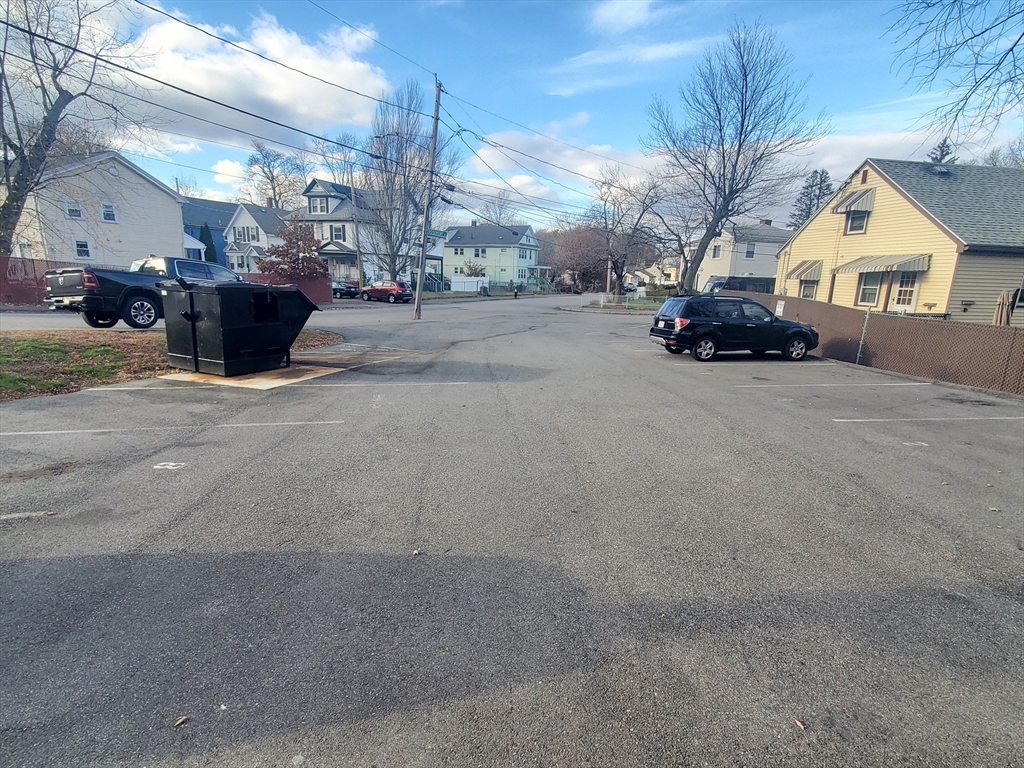 4 Oakcrest Road, Unit 31 Boston, MA 02136 - Photo 11 of 12 a view of living room filled with furniture and a chandelier