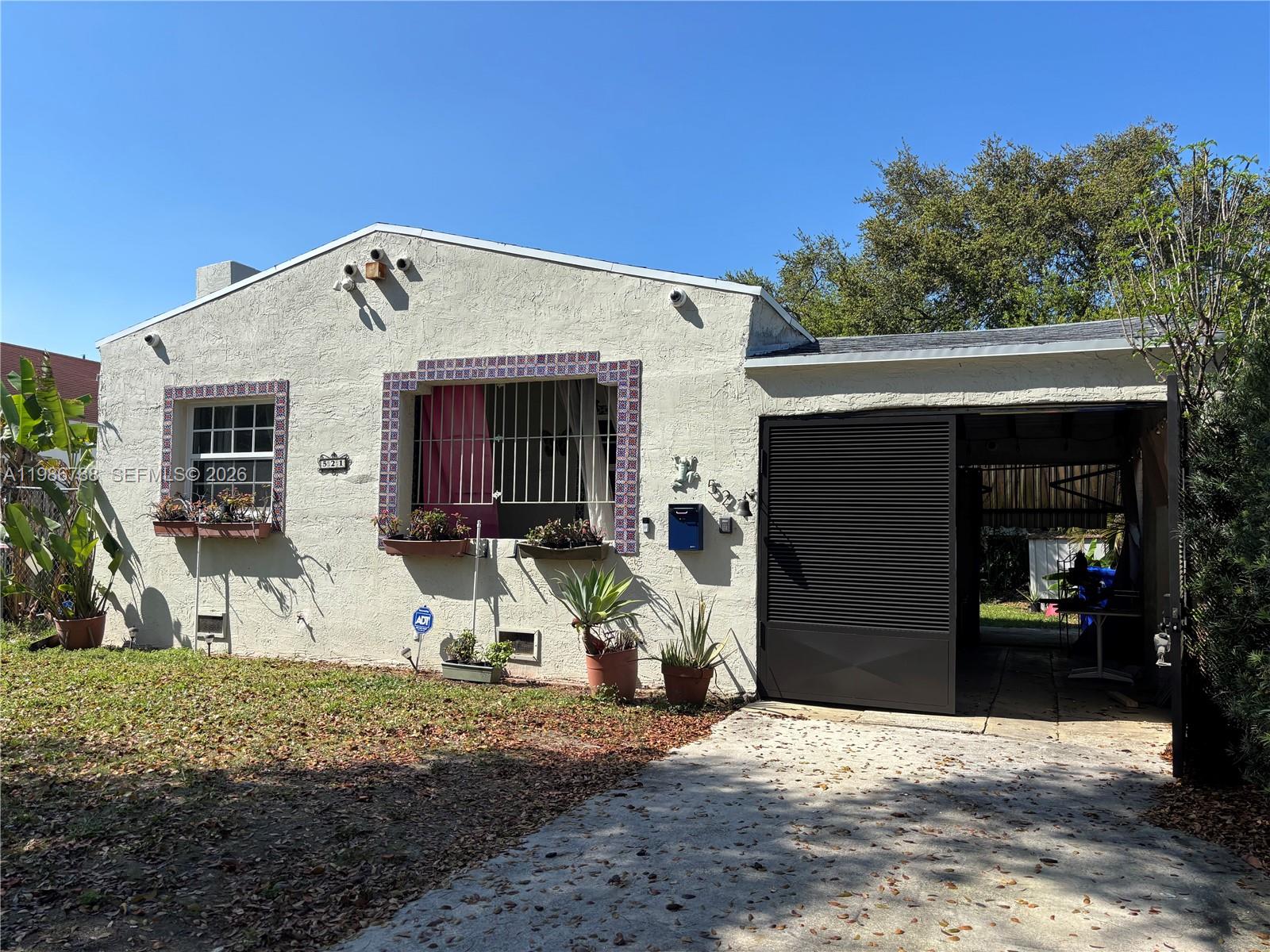521 Northwest 48th Street Miami, FL 33127 - Photo 2 of 30 a view of a house with backyard
