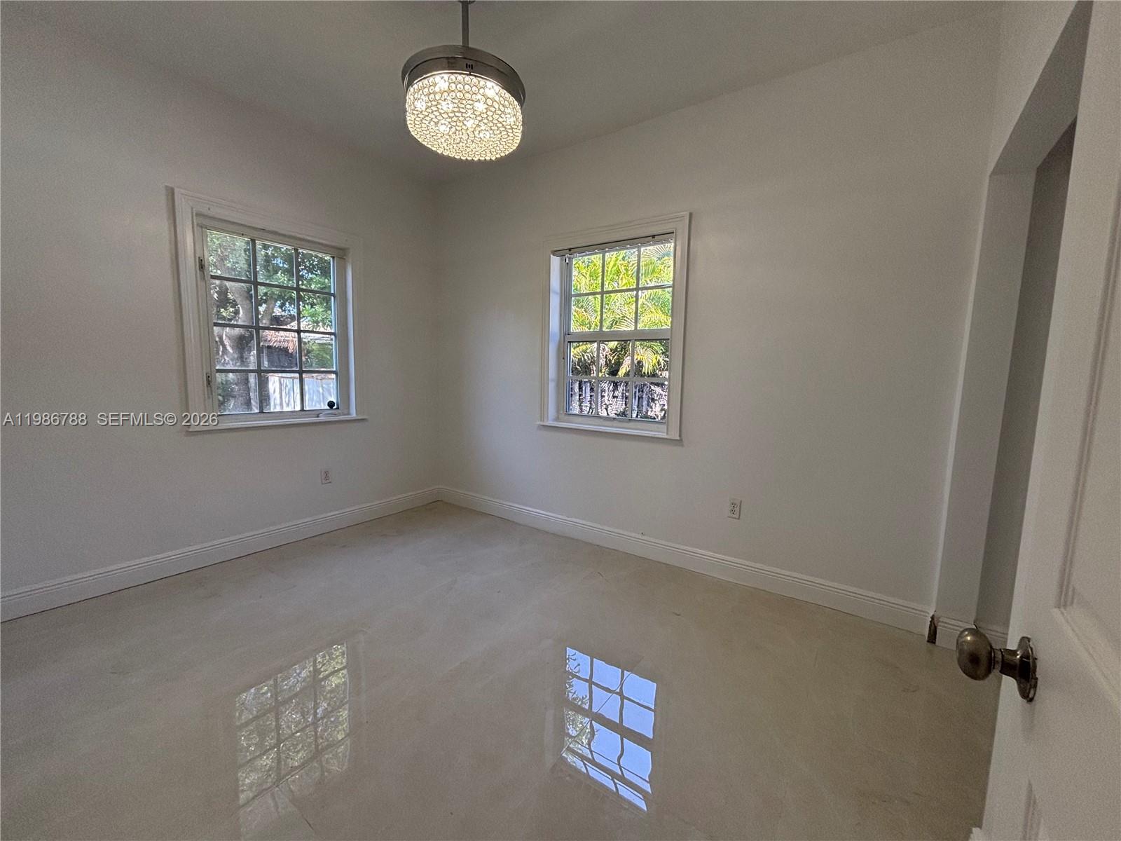 521 Northwest 48th Street Miami, FL 33127 - Photo 23 of 30 a view of an empty room with a window