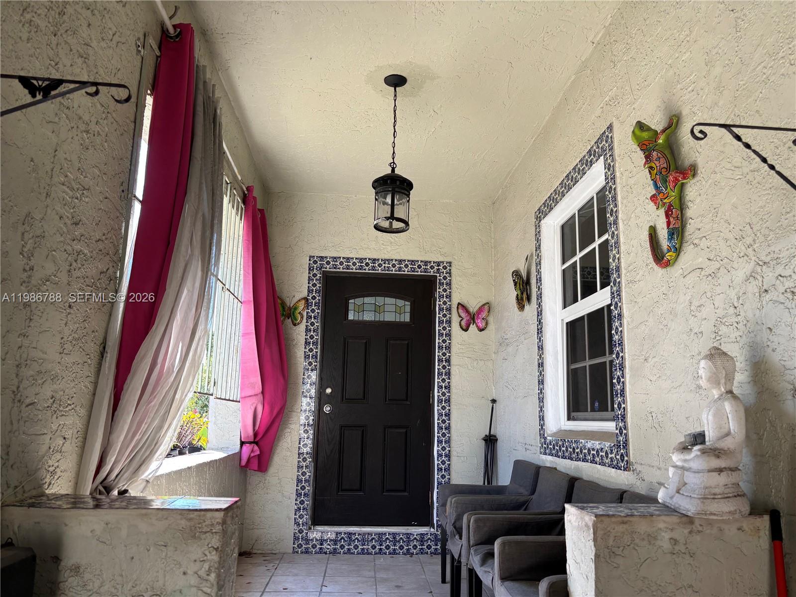 521 Northwest 48th Street Miami, FL 33127 - Photo 26 of 30 a front view of a house with a window