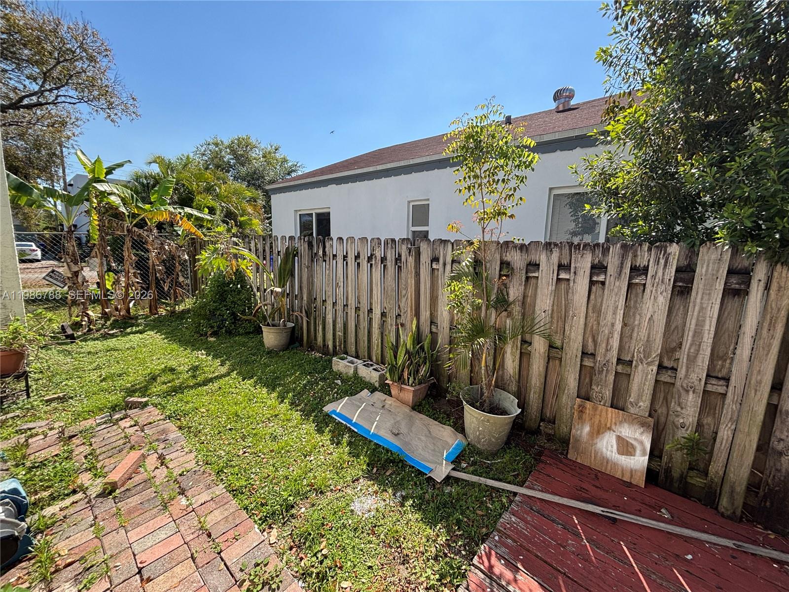 521 Northwest 48th Street Miami, FL 33127 - Photo 27 of 30 a view of a backyard with a garden