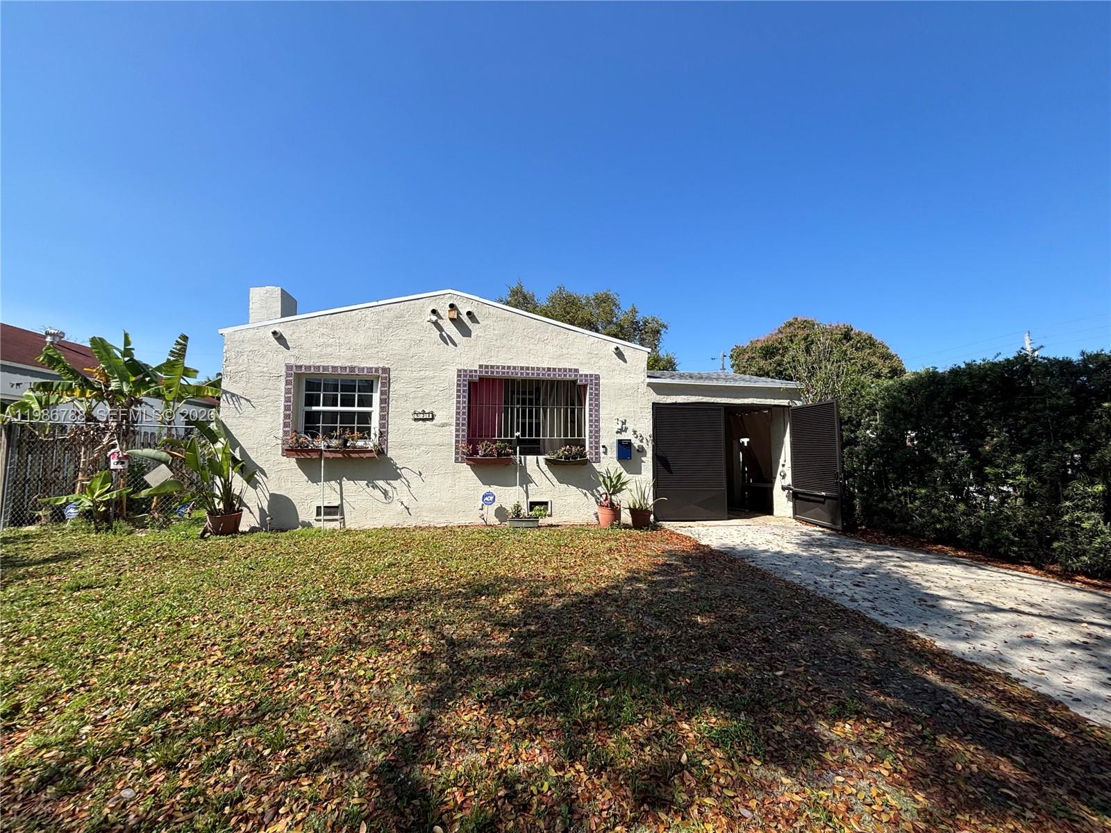 521 Northwest 48th Street Miami, FL 33127 - Photo 30 of 30 a view of a house with a yard