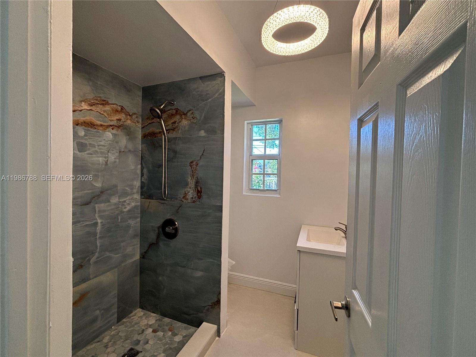 521 Northwest 48th Street Miami, FL 33127 - Photo 9 of 30 a bathroom with a shower